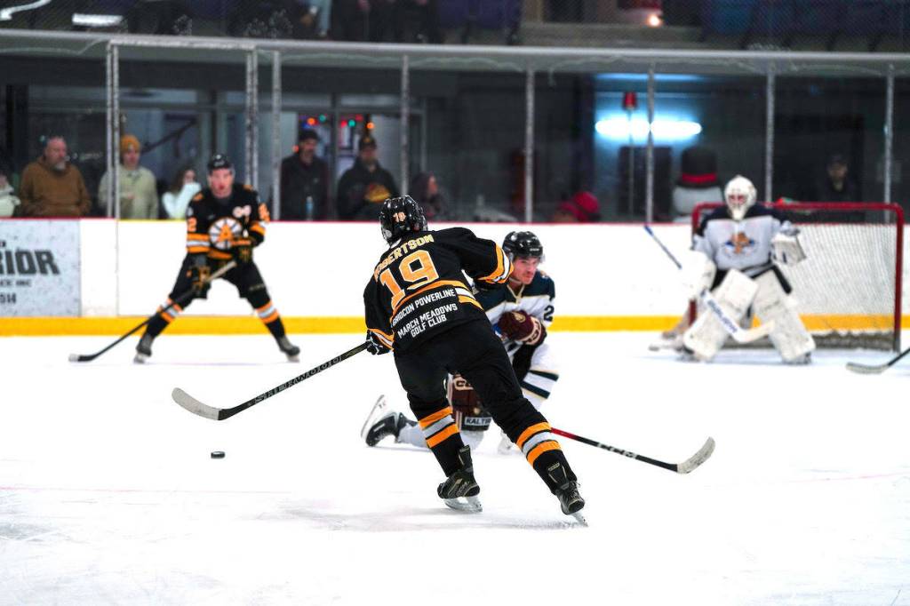 Defender Billy Robertson fires the puck up to a teammate during the Lake Cowichan Appollos&rsquo; 10-3 loss to the Hope Icebreakers on Dec. 13 at the Cowichan Lake Sports Arena. (Sean Buckland photography)