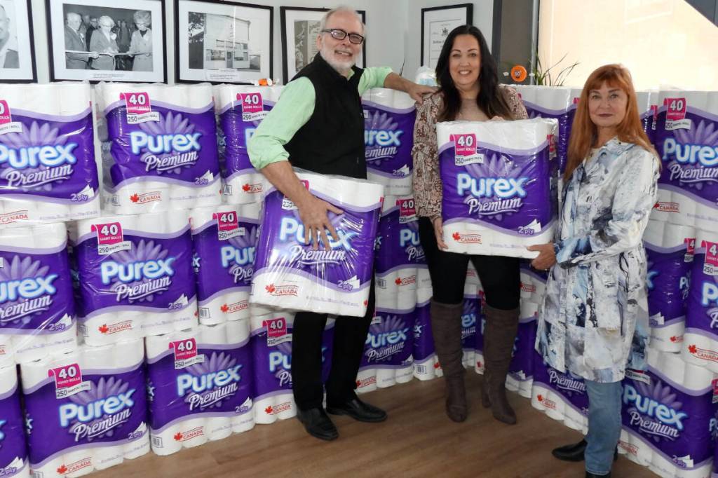 The first time they took a shot at it, the management and staff at the Ladysmith and District Credit Union went way above and beyond in the toilet paper fundraiser for the local Food Pantry. Pictured with their 1,200 rolls of toilet paper are (from left) Michael Robinson, director of marketing; Courtney Henn, assistant manager of member services; and Andrea Rosetto-Taylor, chair of the Ladysmith and District Arts Council. (Duck Paterson photo)